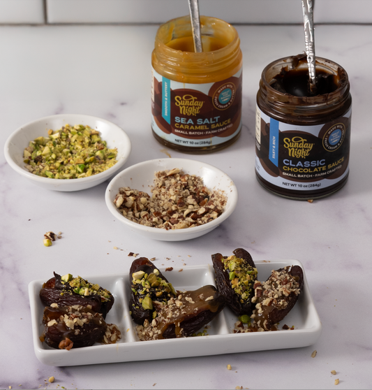 Sunday Night Sea Salt Caramel & Classic Chocolate Sauce Jars frame chopped nuts and tasty filled dates.